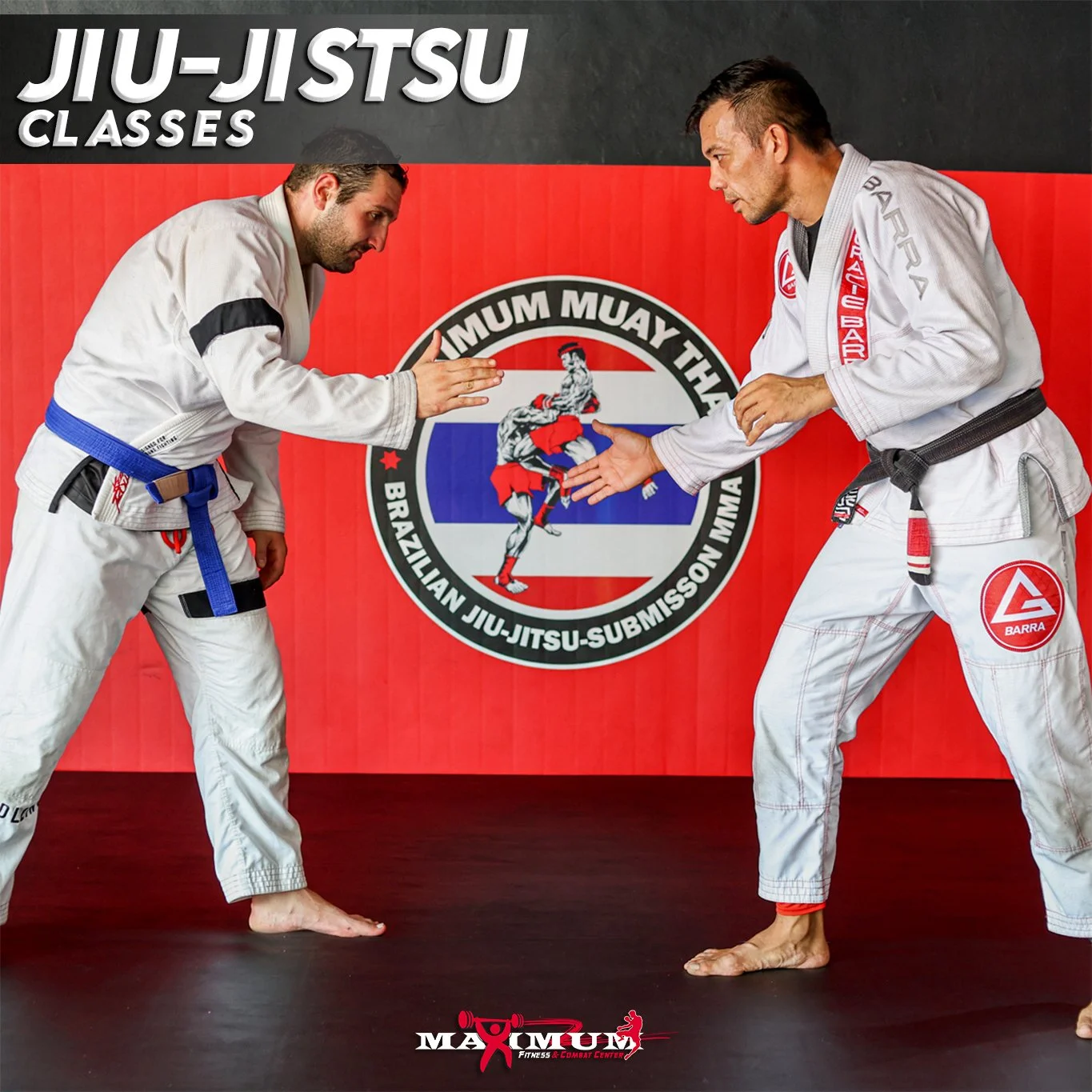Two men in Brazilian Jiu-Jitsu gis practicing a stance in front of a red and black martial arts banner at a gym.