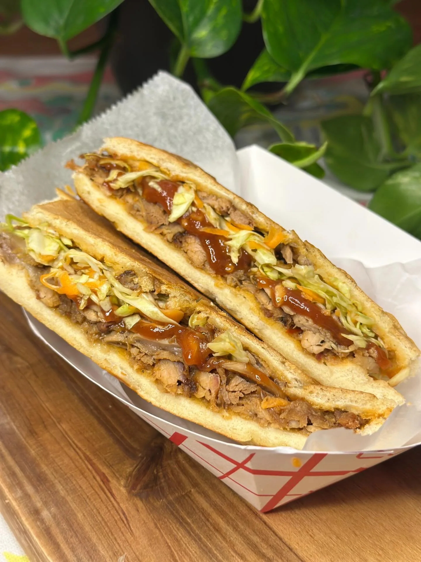 Menu feature: Guava BBQ Pernil Sandwich 🐖

Pressed on French bread, just like Ma would use after church, this one has slow roasted pernil (pork) and house made guava bbq with a pique slaw for some freshness.