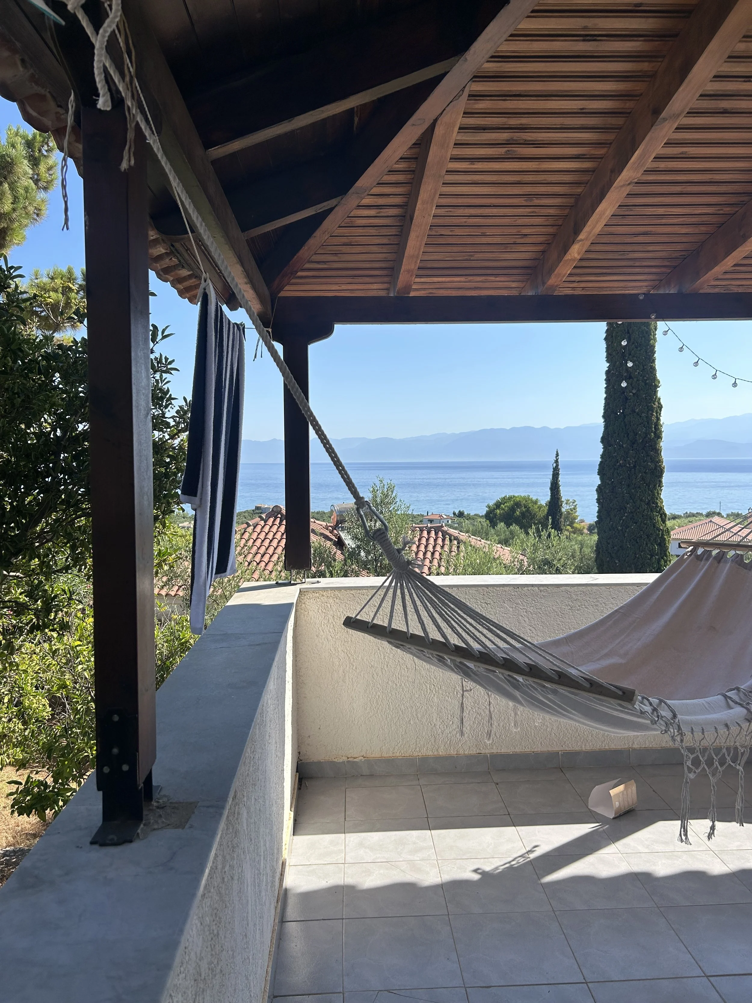 Villa Nestors holiday villa Greece – shaded terrace with hammock and sea views, SaintFriday Villas