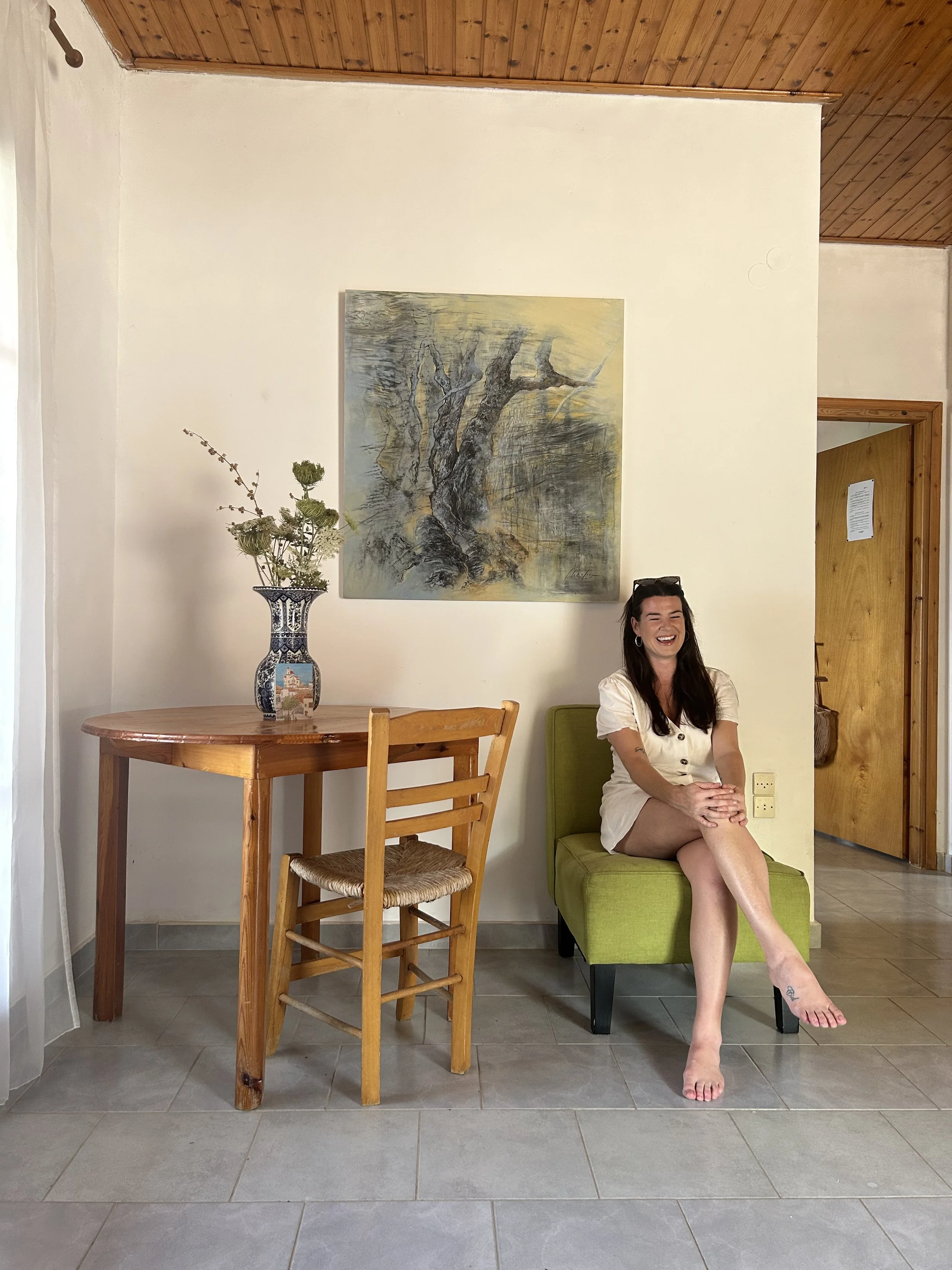 Holiday villa interior Messinia Greece – bright airy living space with artwork and wooden furniture, Saint Friday Villas