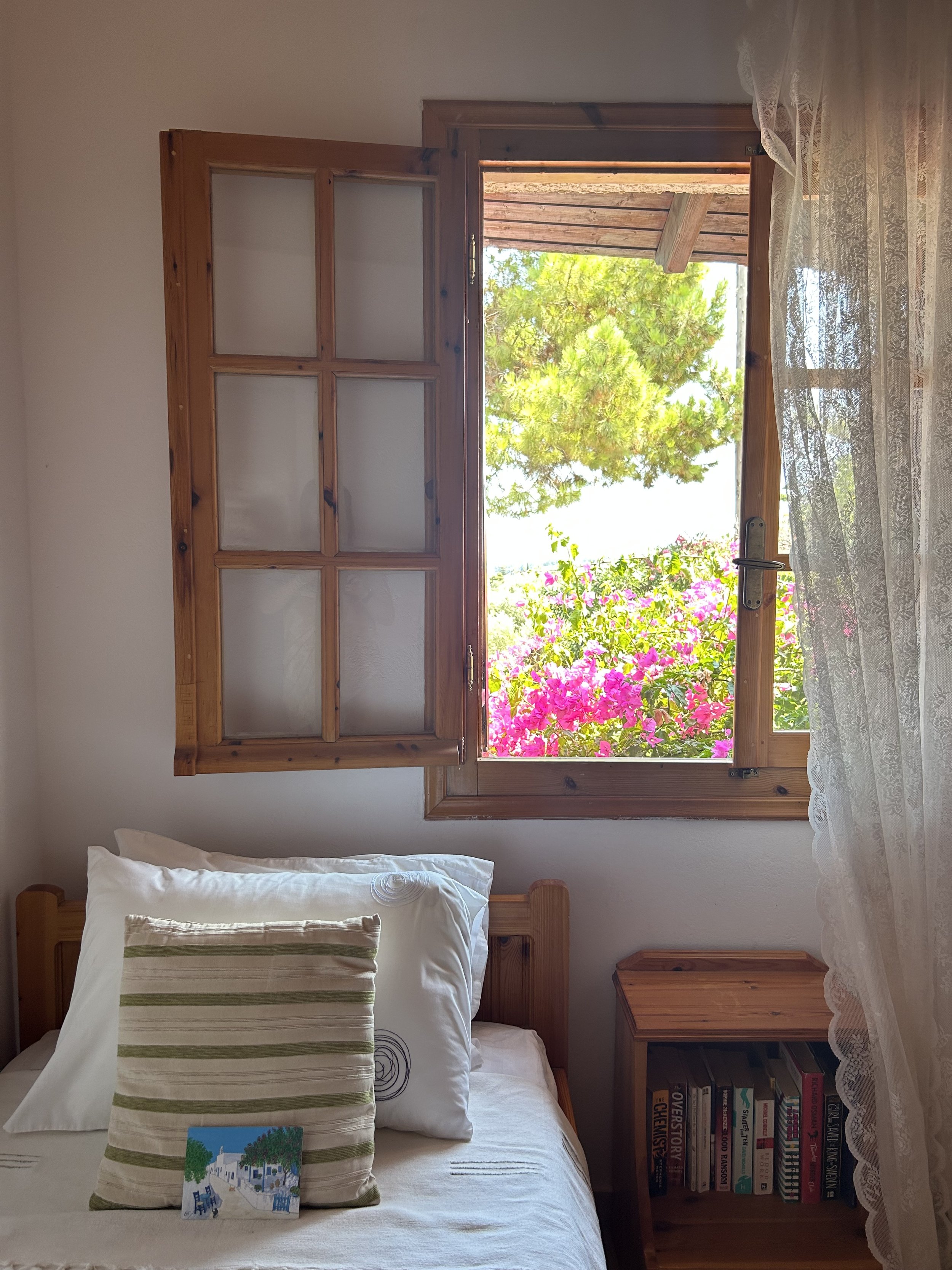 Koroni holiday apartment Messinia Greece – characterful room with timber window and pink bougainvillea, Saint Friday Villas
