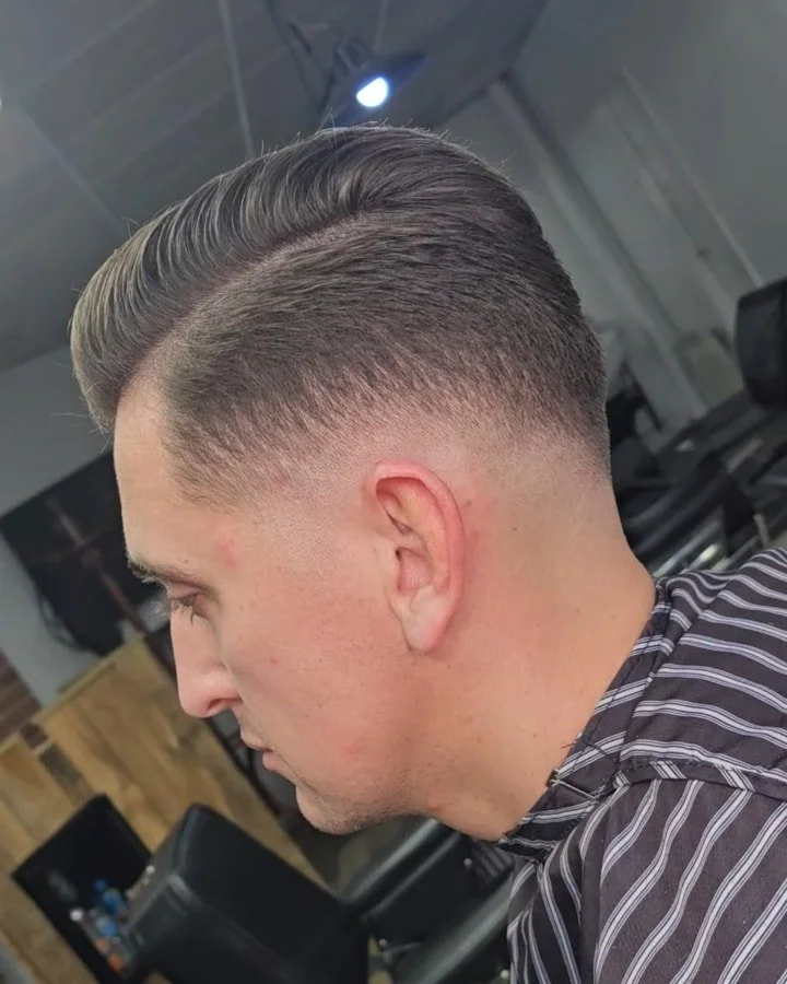 Classic side part, modern fade.
