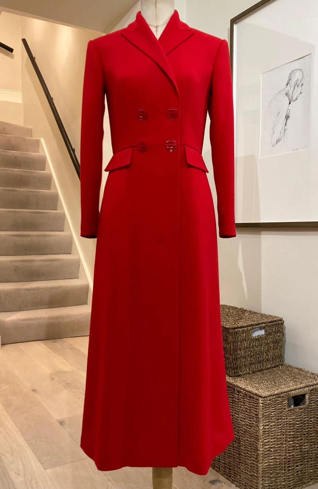 Finished bespoke red coat dress with tailored silhouette, finished at the PETAR atelier.