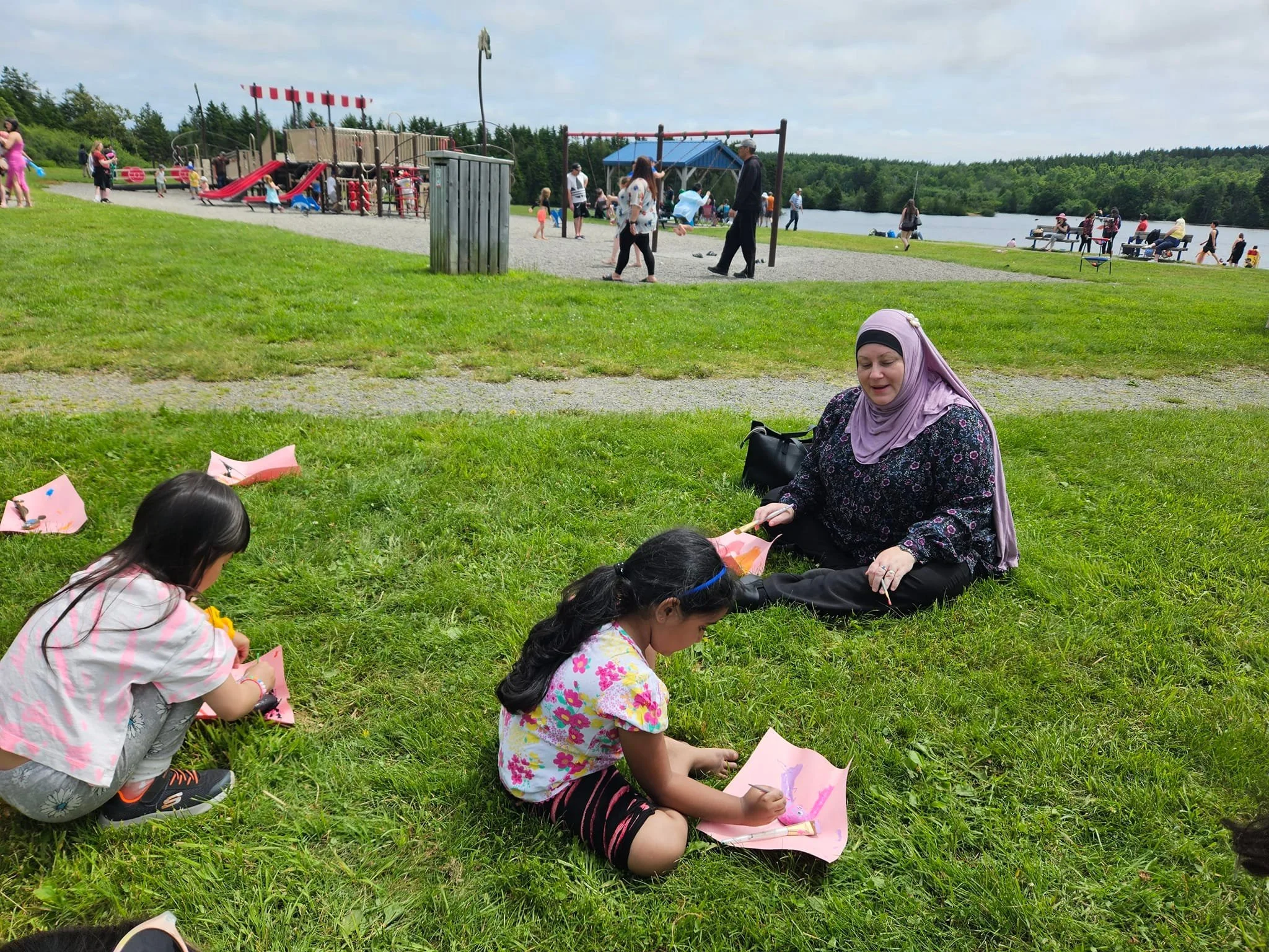 Paula painting rocks with our youth at Passport to Parks at the Rez. The YMCA was organizing the rock painting. 