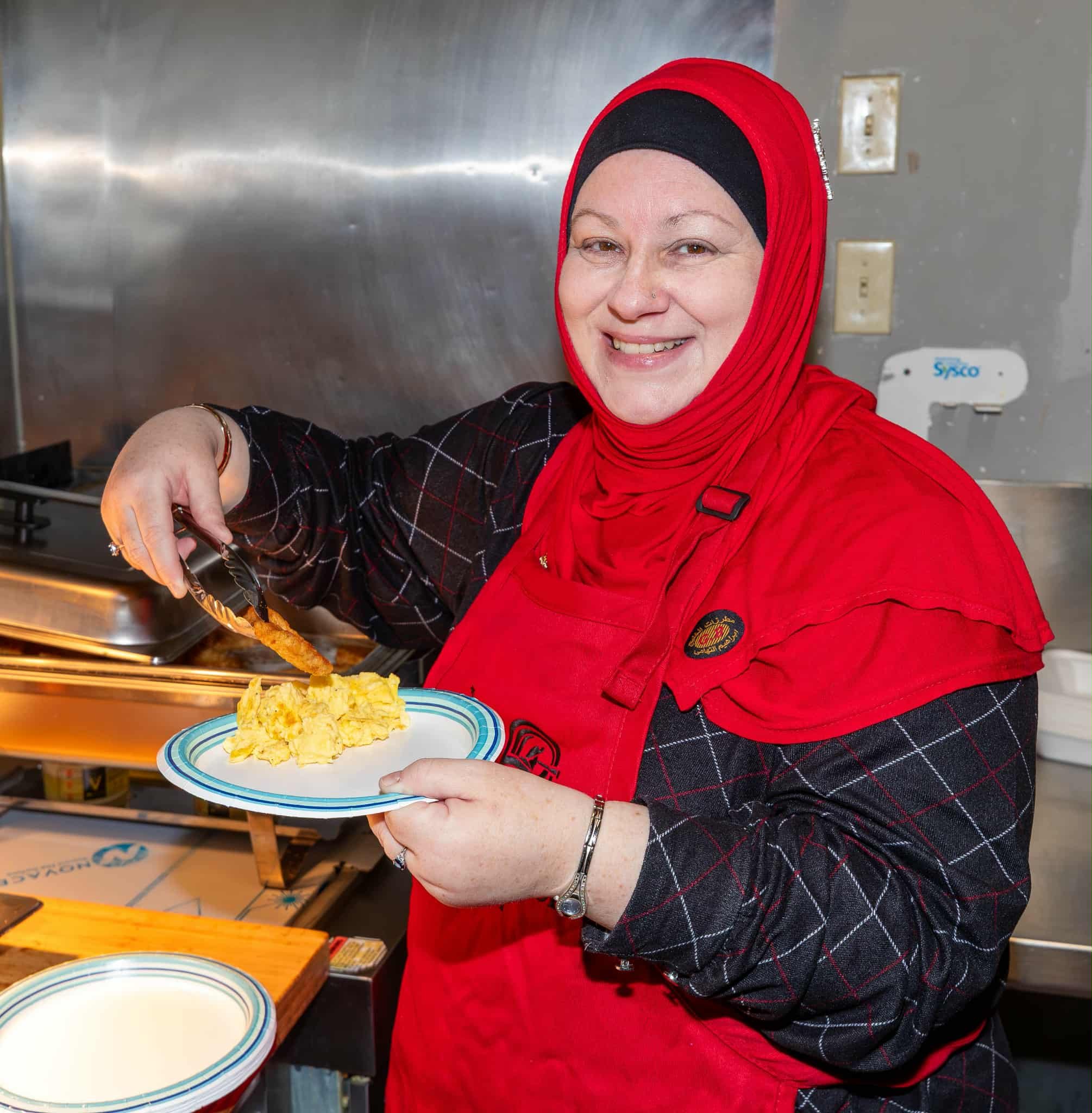 Paula helping serve up breakfast at Christmas time to raise money for Harbor Lights that supports food banks from Sussex to St.Stephens. 