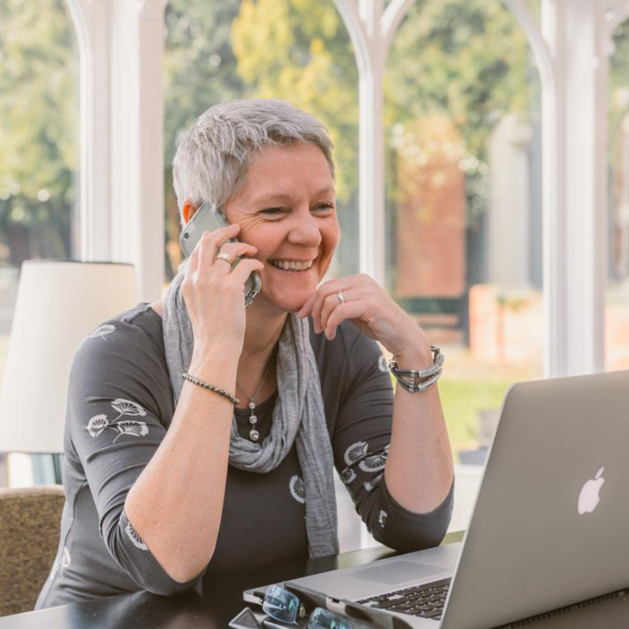 Karen Peters on the phone to a client