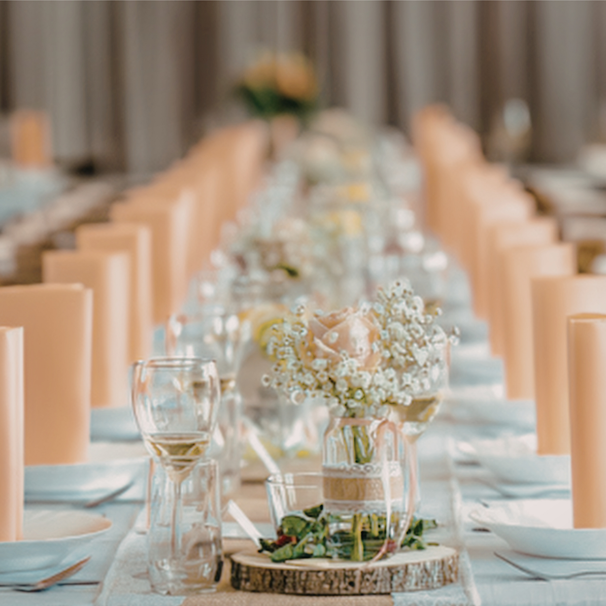 Elegant banquet table decorated with flowers and candles for a special event or wedding