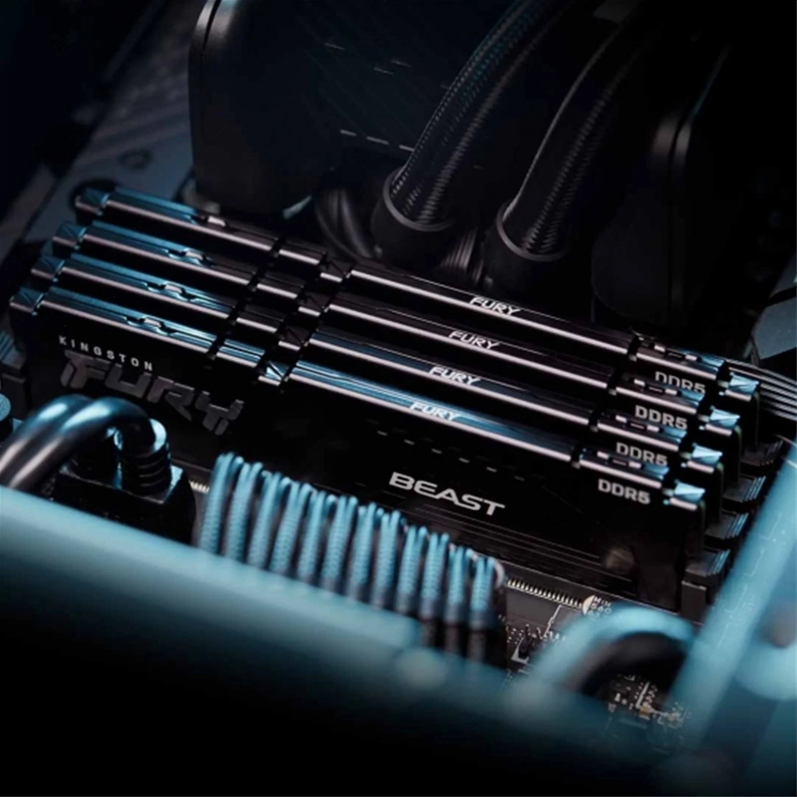 Four Kingston FURY Beast DDR5 memory modules installed on a workstation motherboard with AIO liquid cooling loop above