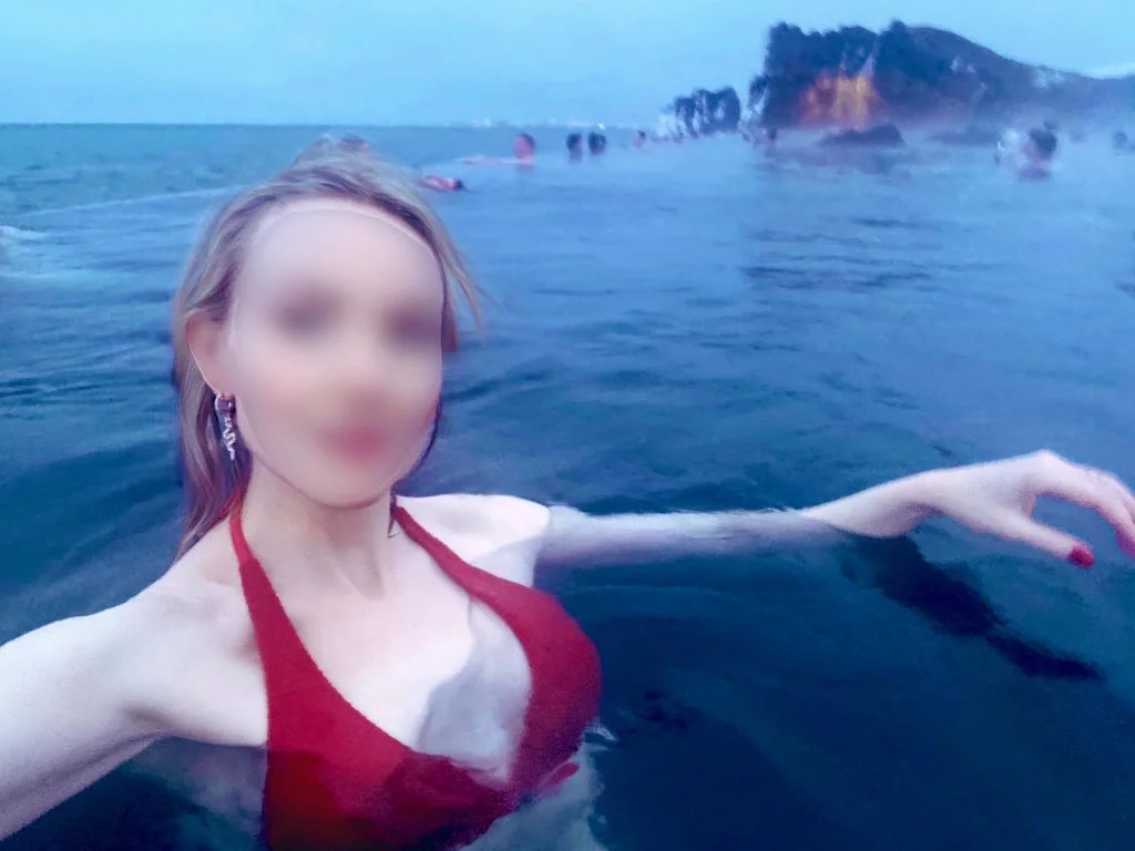 Blonde high class independent London escort in an thermal pool in Iceland on a FMTY travel companion date.