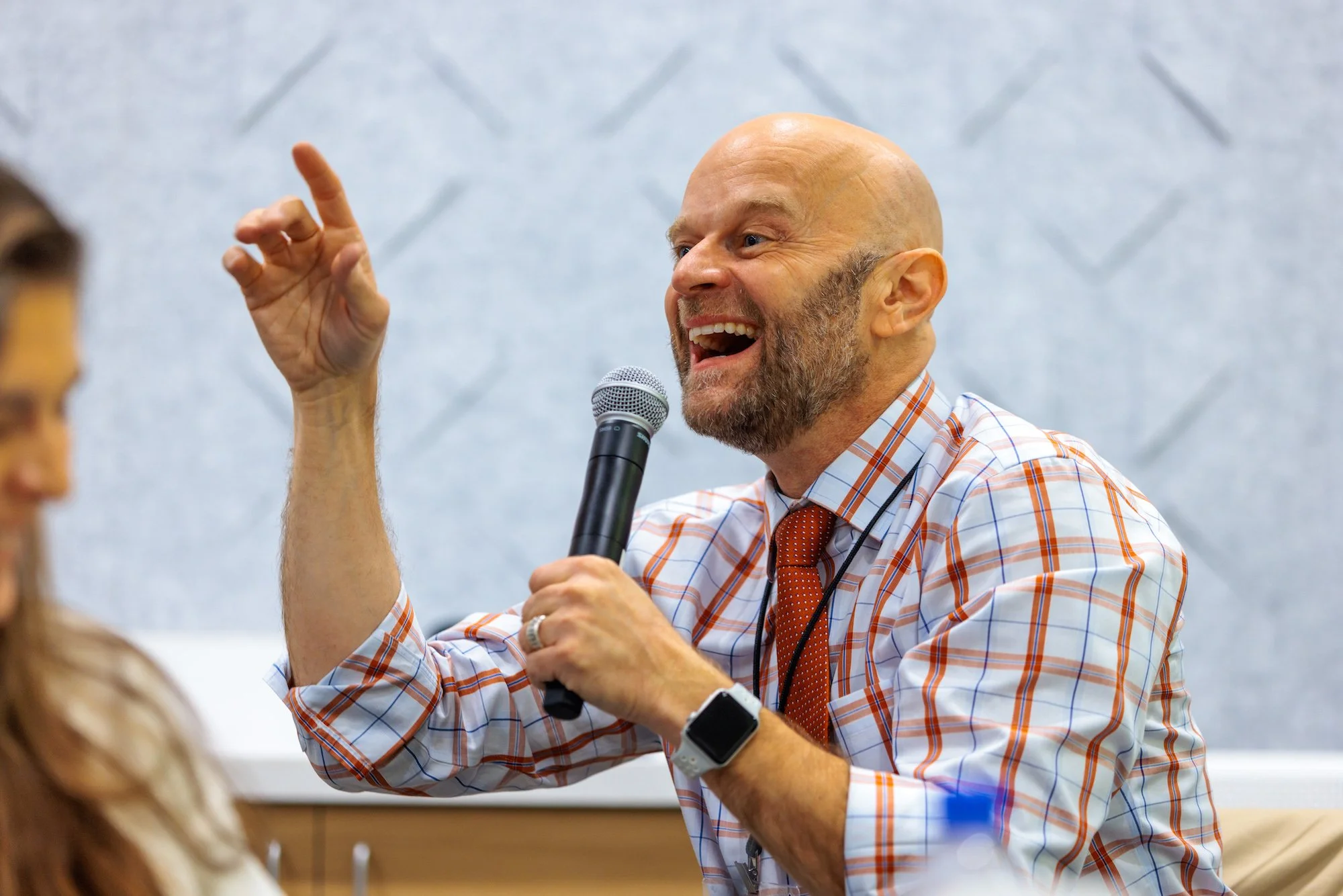 Brent Strawn at a speaking event, gesturing.