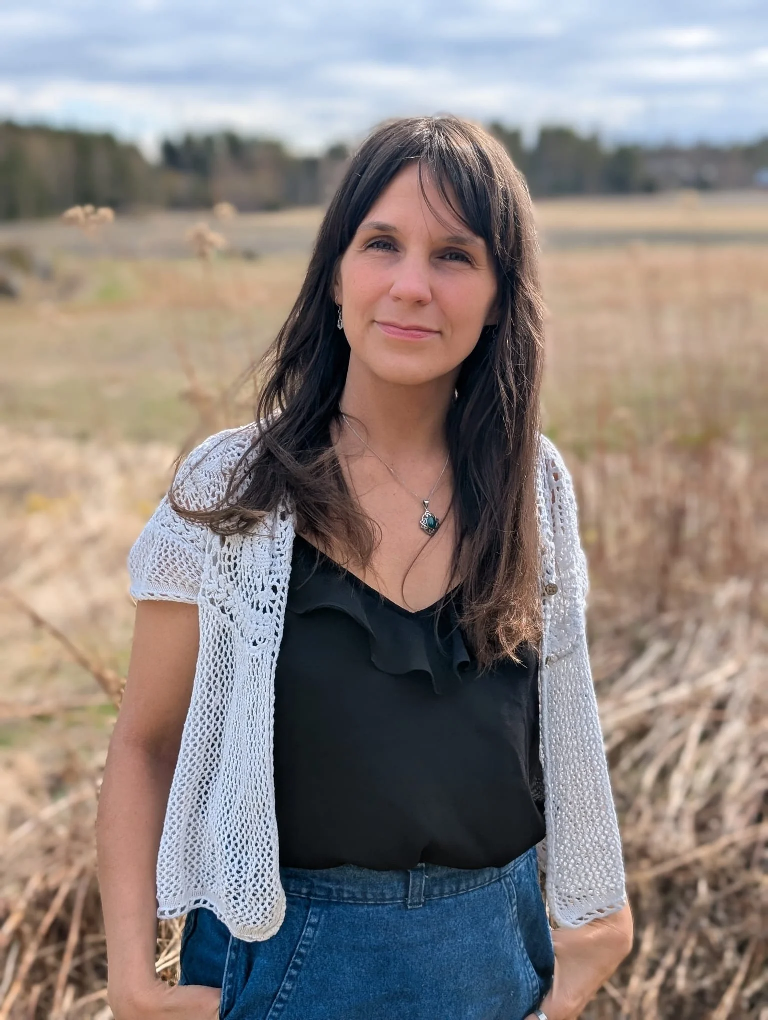 woman standing with field background