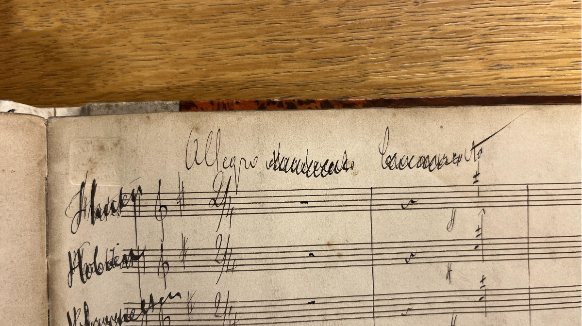 Handwritten musical score on aged paper with some notes and annotations.
