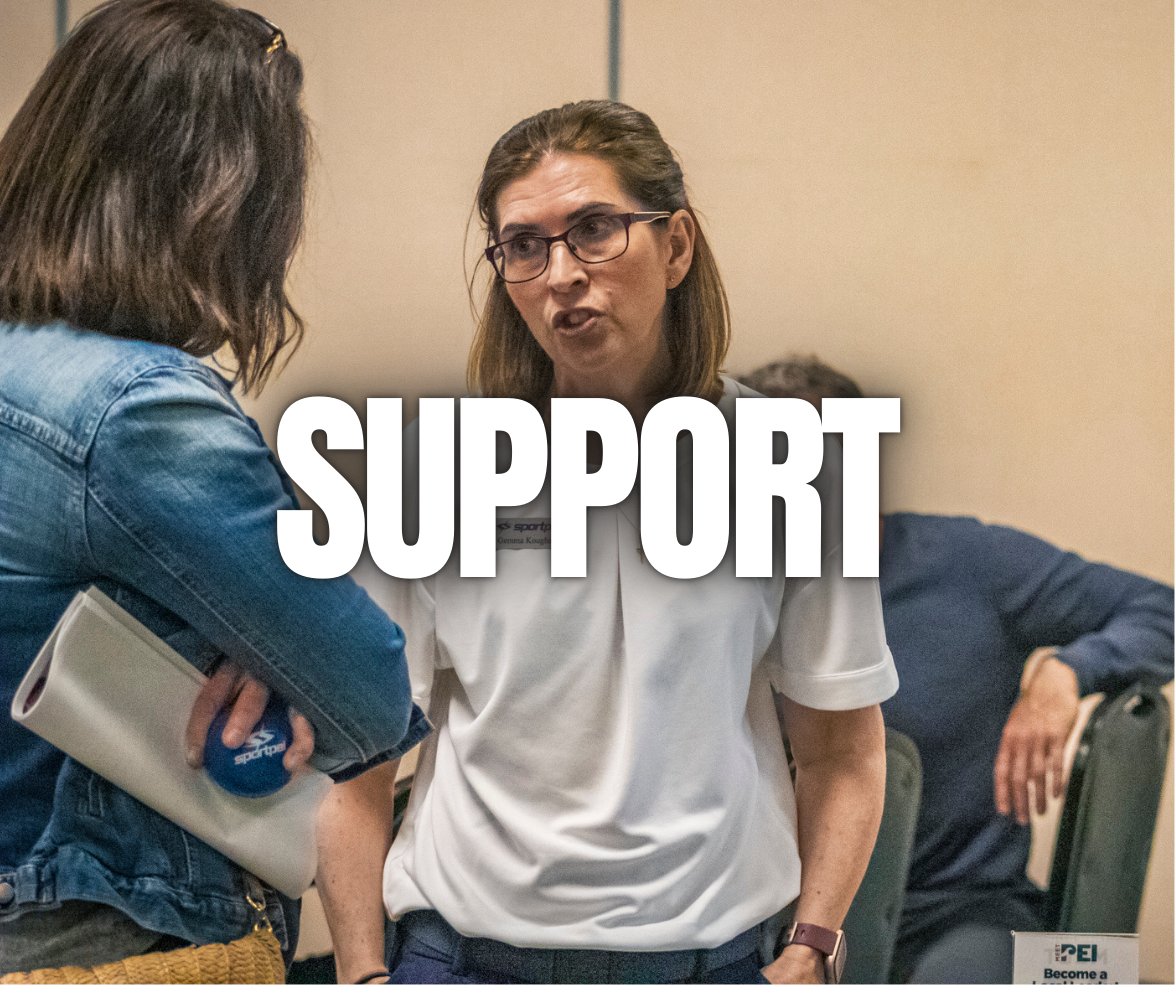 Two women in conversation at an indoor event, with the word "SUPPORT" overlaid.