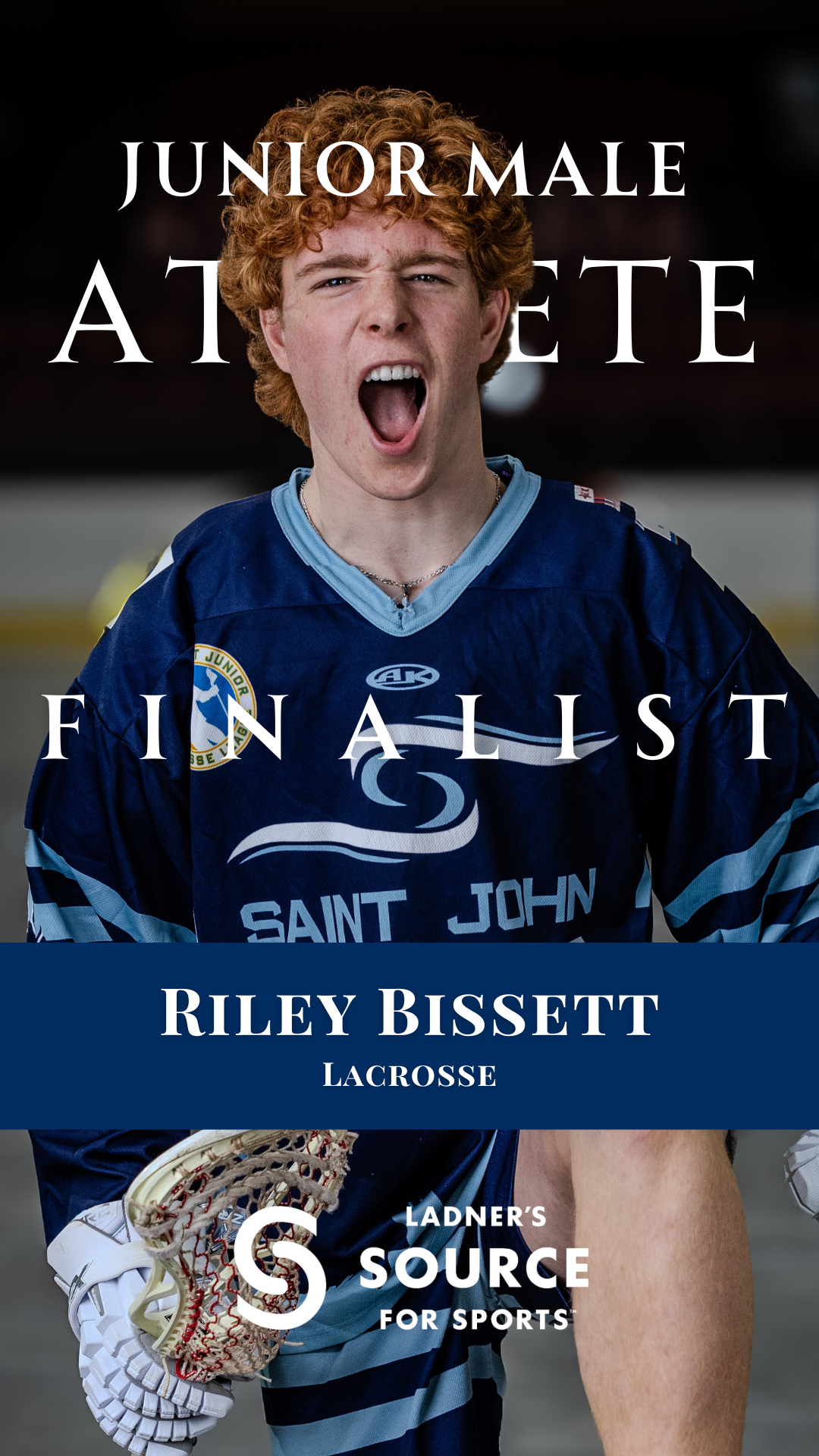 Young male lacrosse player in blue Saint John jersey with mouths open, likely celebrating or shouting, on an indoor sports court.