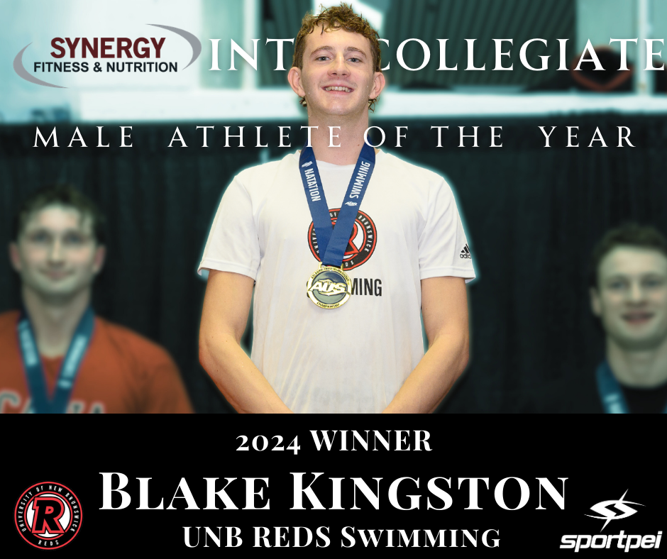 Young man with medals around his neck, smiling, at an award ceremony for male athlete of the year in 2024, representing UNB Reds Swimming, with two other smiling young men in the background.