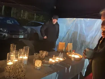 candle seller at xmas 2025.webp