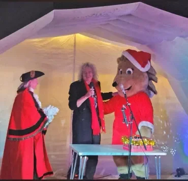 brian may at christmas  with grace and mayor.webp