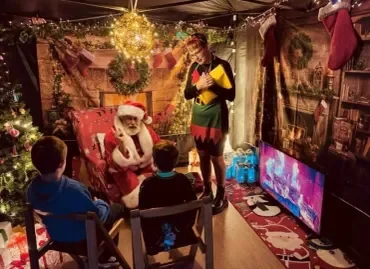 Santa meeting windlesham children in the grotto