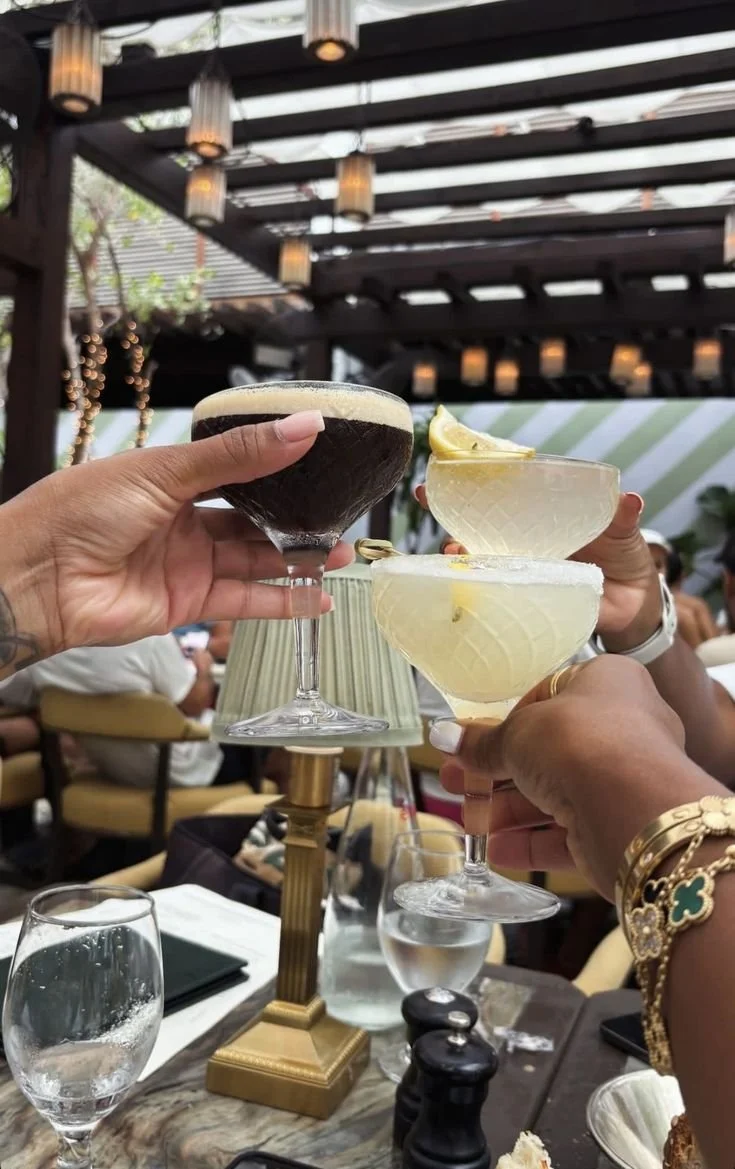 A martini cocktail with olives