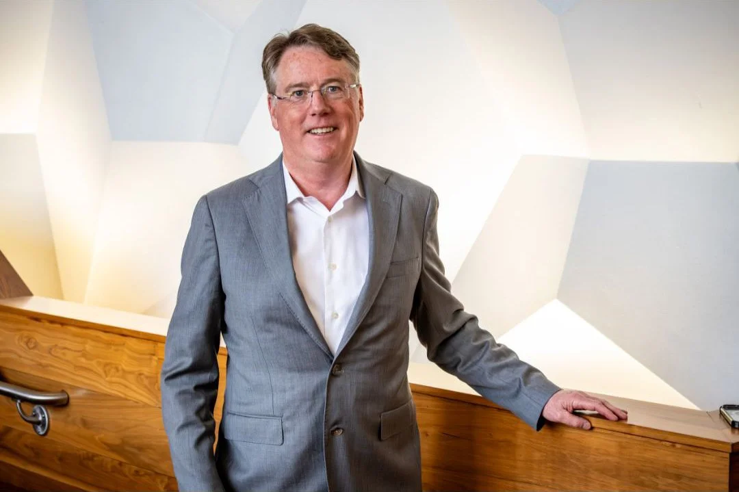 Aidan Connolly standing in a modern professional setting, reflecting his leadership and advisory work in global food and agriculture.