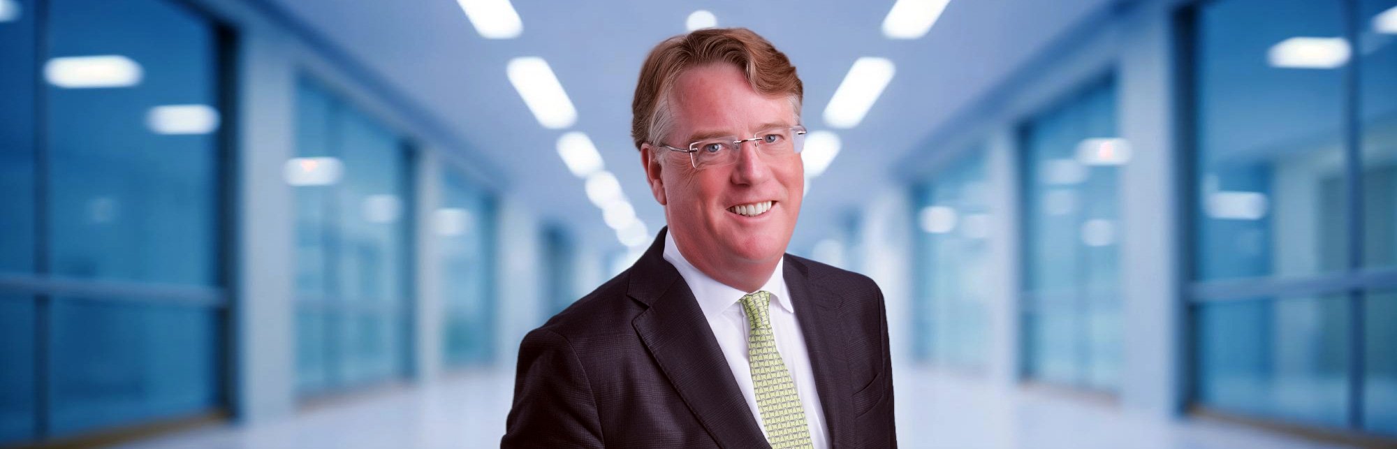 “Aidan Connolly standing in a modern office environment, representing Agritech Capital’s leadership in global agriculture and ag‑innovation investment.