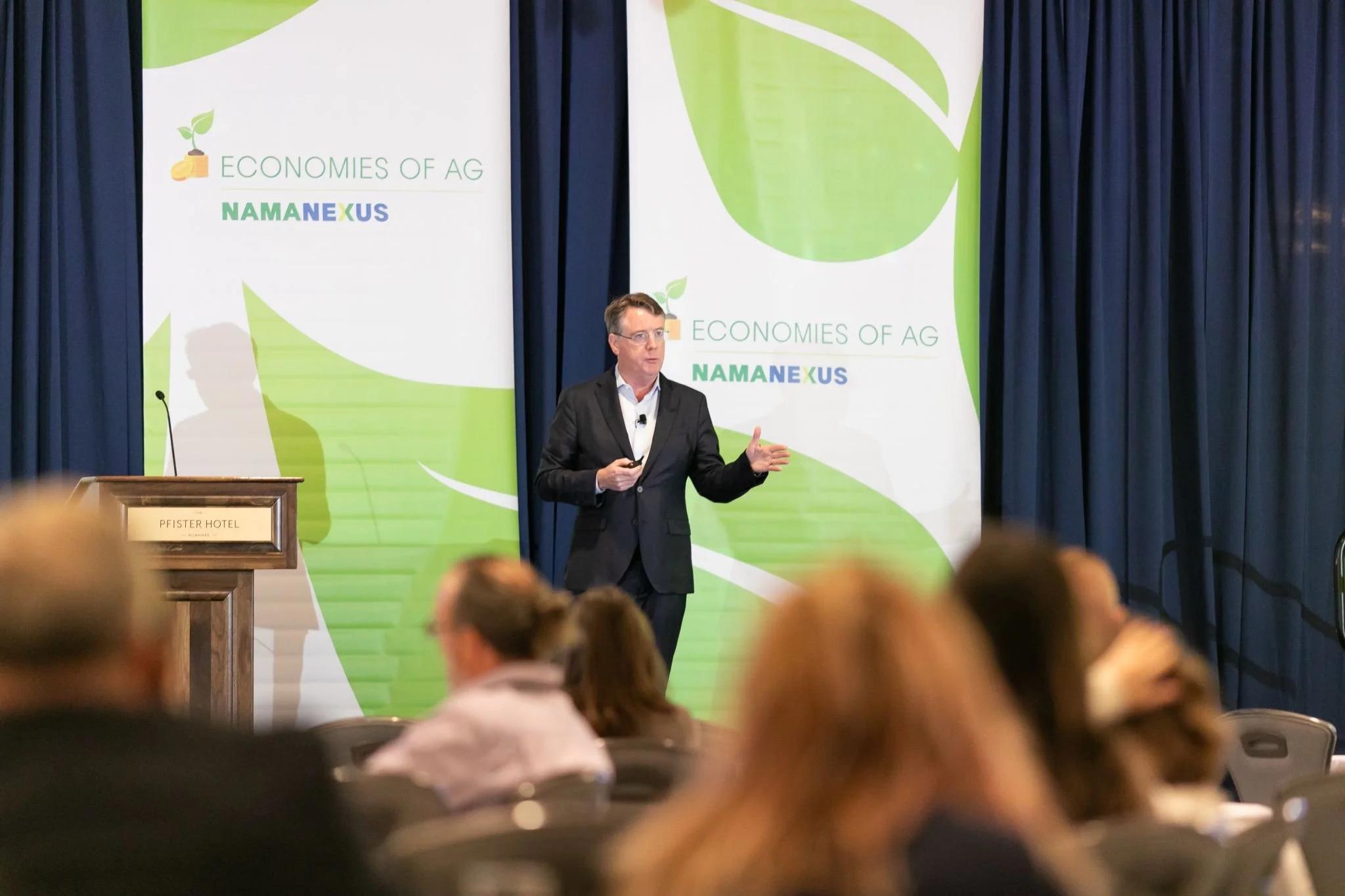 Aidan Connolly presenting at the NAMA Nexus agri‑communication event, addressing professionals in agriculture marketing and communication.