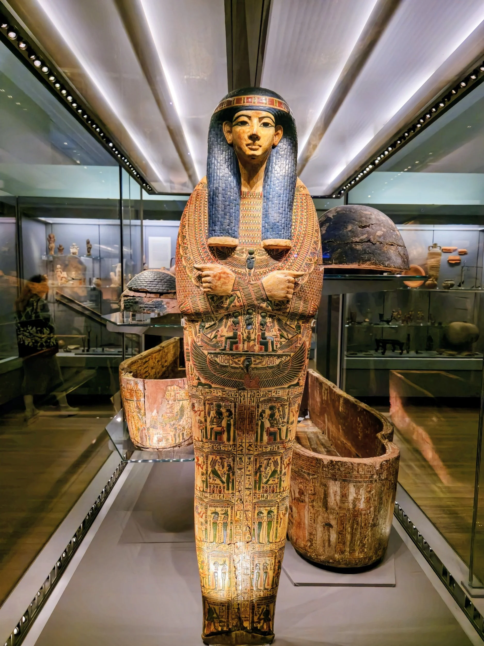 Intricately decorated "yellow style" coffins of Nespawershefyt, Chief of Scribes, displayed at the Fitzwilliam Museum.
