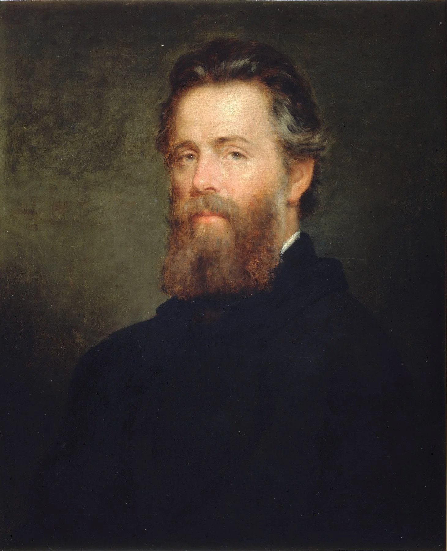 A portrait of a man with a beard, wearing a dark coat, looking slightly to the left, with a neutral background.