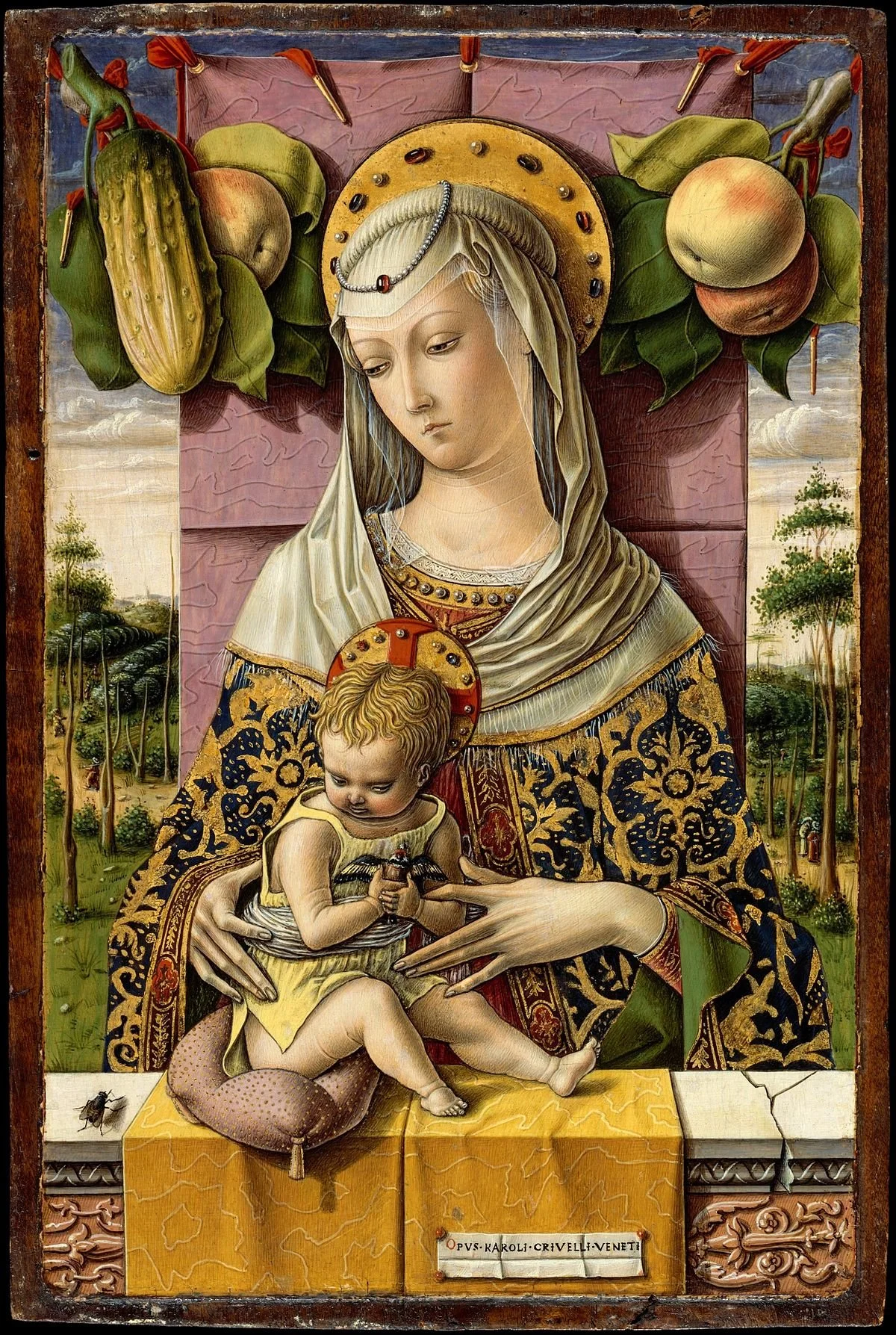 Religious artwork depicting the Madonna and Child, with lush trees and landscape in the background. The Madonna wears a decorated garment and a headdress with a halo, holding a child who also has a halo. The child is holding a small object while sitting on a platform, with a fly on the surface nearby.
