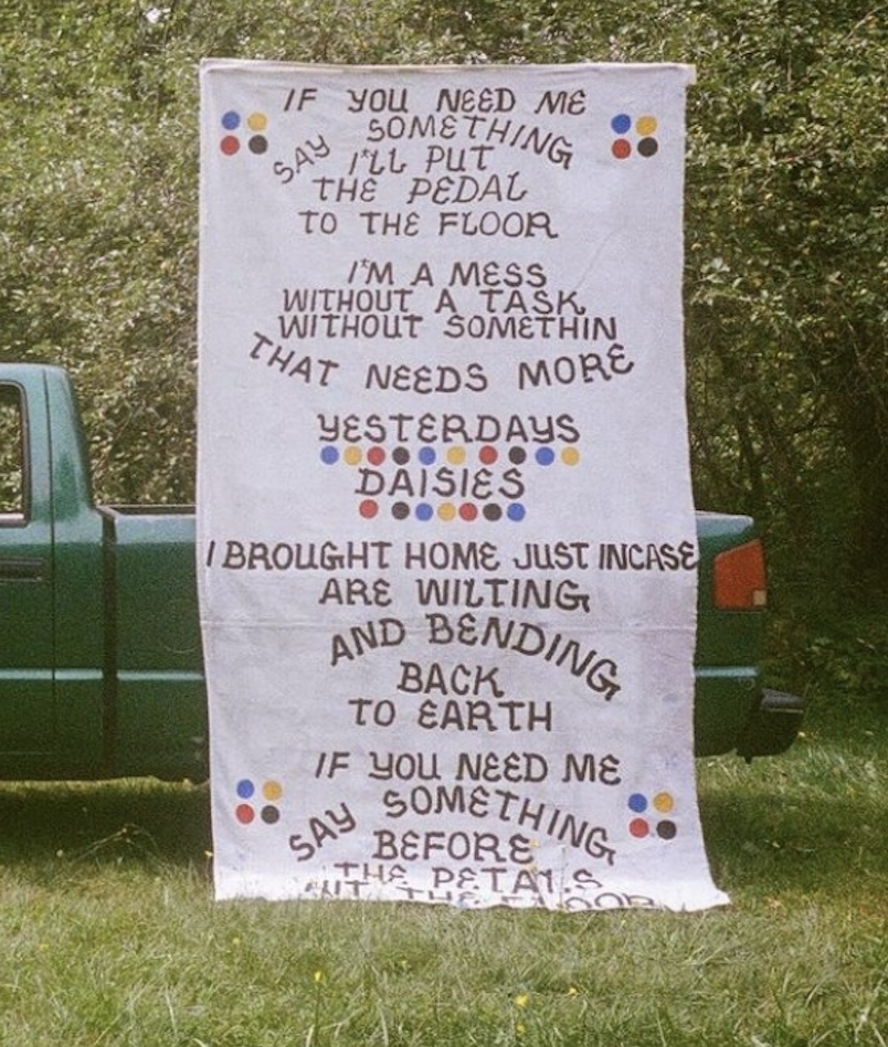 Yesterdays Daisies ✷ 120" H  76" W  1" D ✷ banner hung from Isuzu Hombre