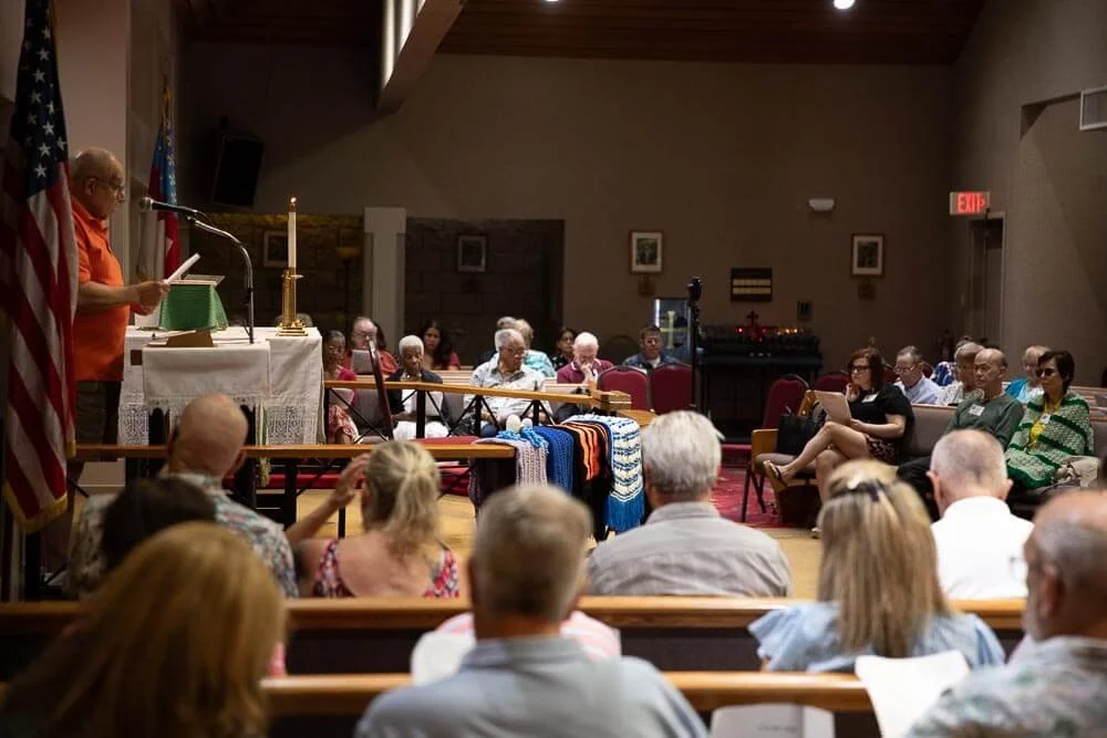 Parishioners reading liturgy during a Sunday worship service at St. Timothy's Episcopal Church in Henderson, NV.