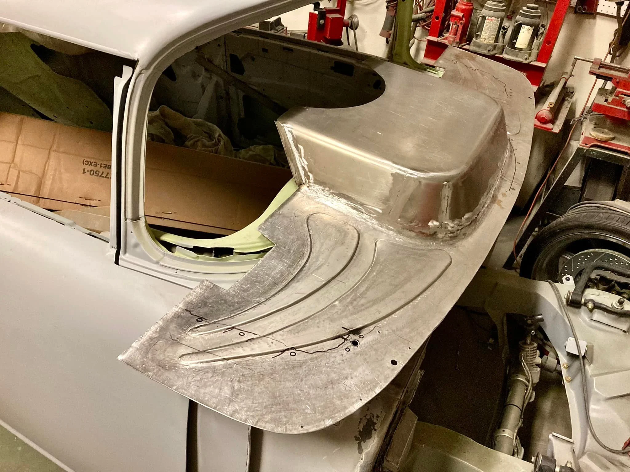 55 firewall. Mounted a “bell crank” 90 degree master cylinder and booster, mounted A/C unit and made lower column mount.