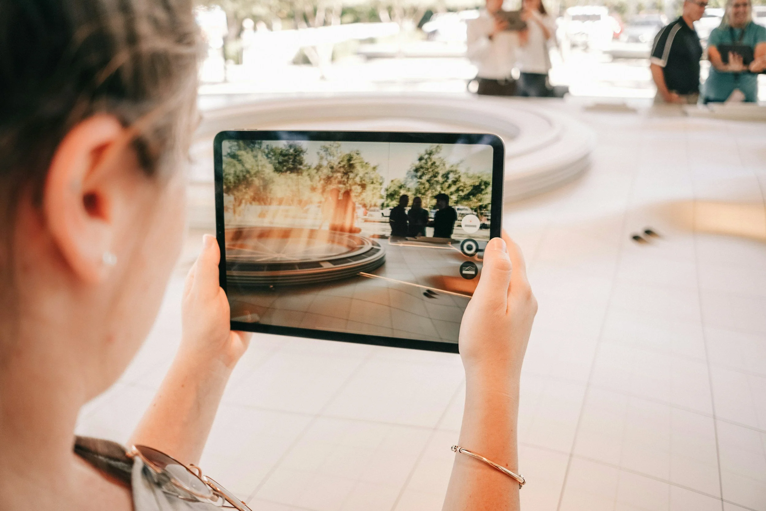 museum guest using tablet to take photo