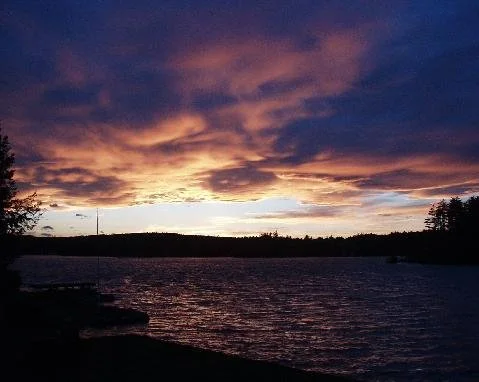 Sunrise with dock in the foreground.