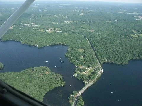 Aerial view of lake and bridge.