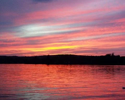 Sunrise with a pink and yellow sky.