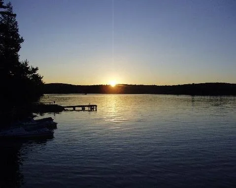 Lake and dock at sunrise.