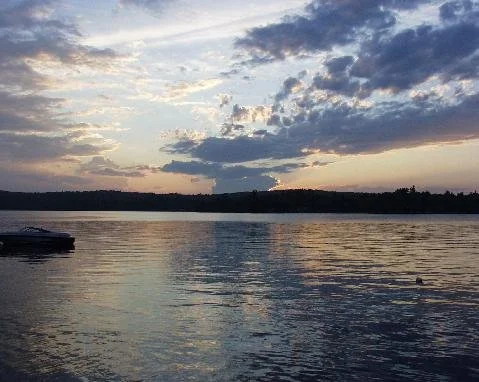 Sunset with clouds reflected in the water.