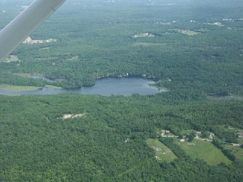 Aerial view of lake and farm land.