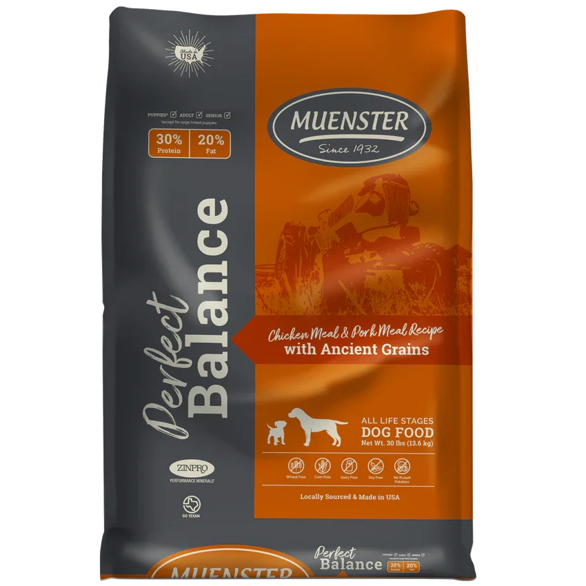 A bag of Muenster Perfect Balance dog food, 30 pounds, featuring chicken and pork recipes with ancient grains, made in the USA, suitable for all life stages.