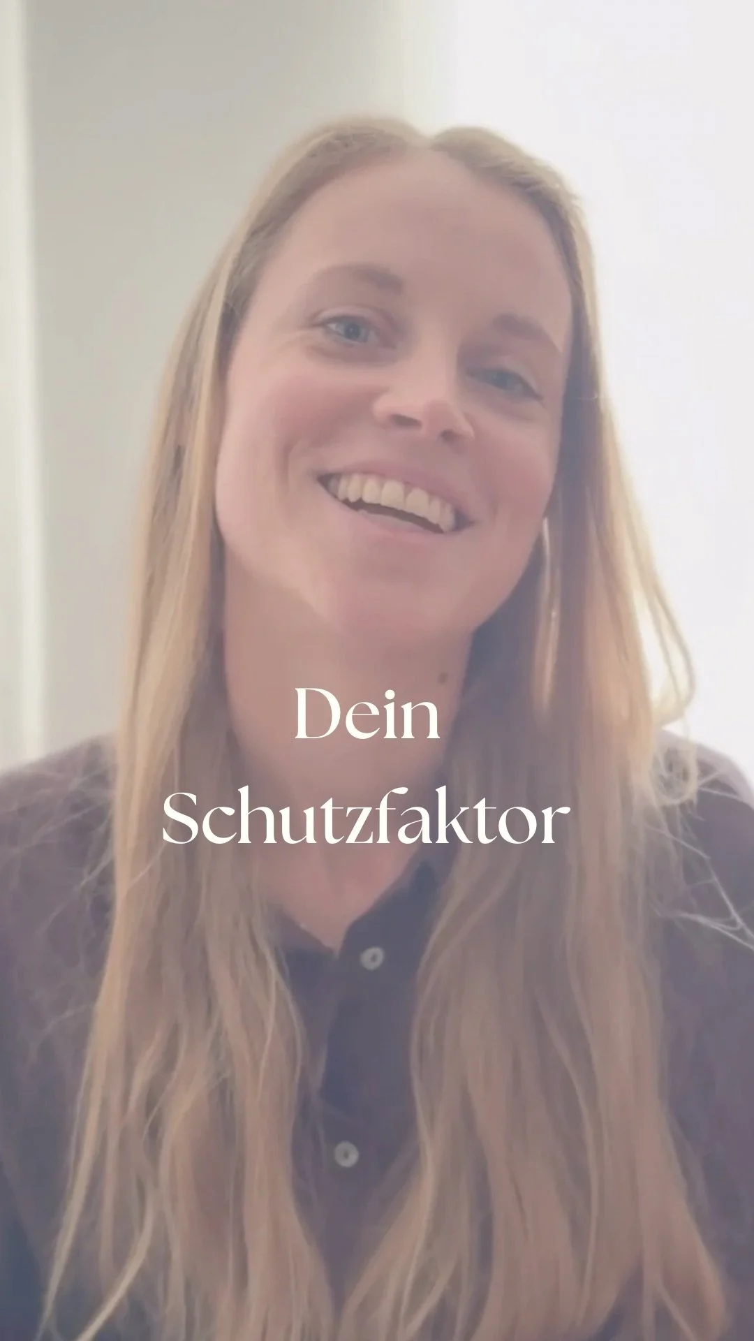 A woman smiling with long blonde hair, wearing a dark polo shirt, with the German words "Dein Schutzfaktor" in white text over her.
