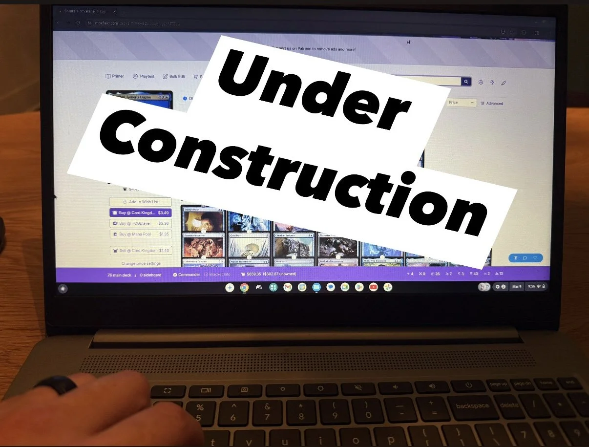 A laptop screen displaying a digital card game interface with a large 'Under Construction' overlay text in black and white.