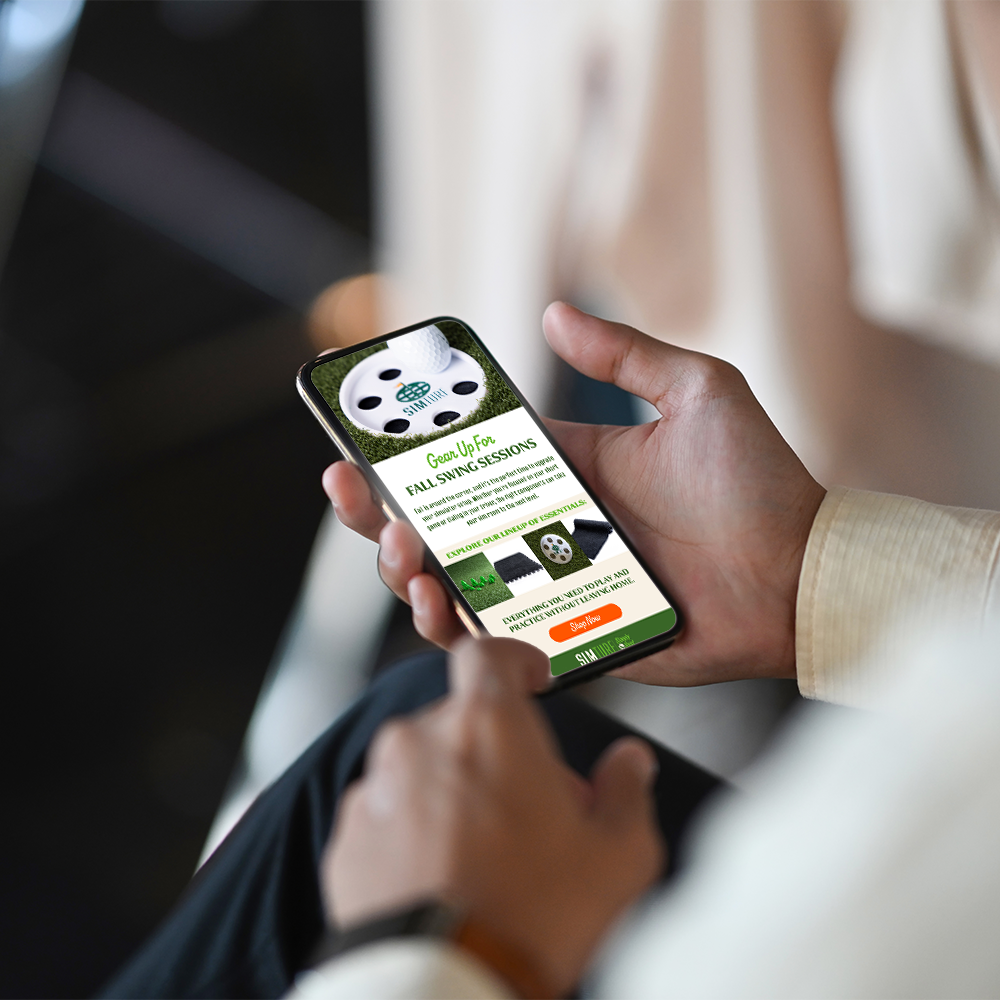 Hands holding a smart phone displaying a golf website.