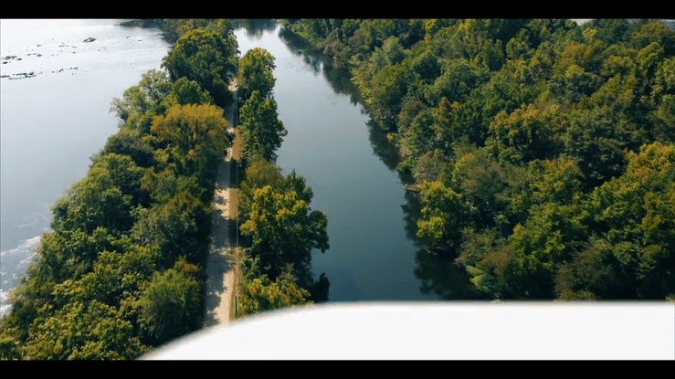 The logo and name of the Augusta Canal Heritage Area appearing over an aerial shot of the Savannah River.