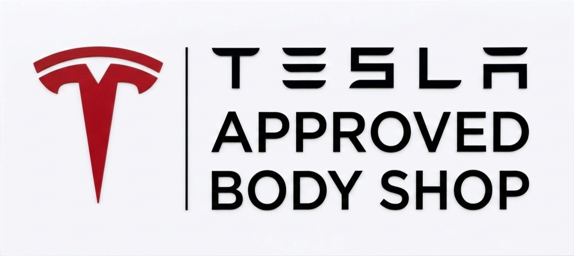 Tesla logo with the text "Tesla Approved Body Shop" on a white background.