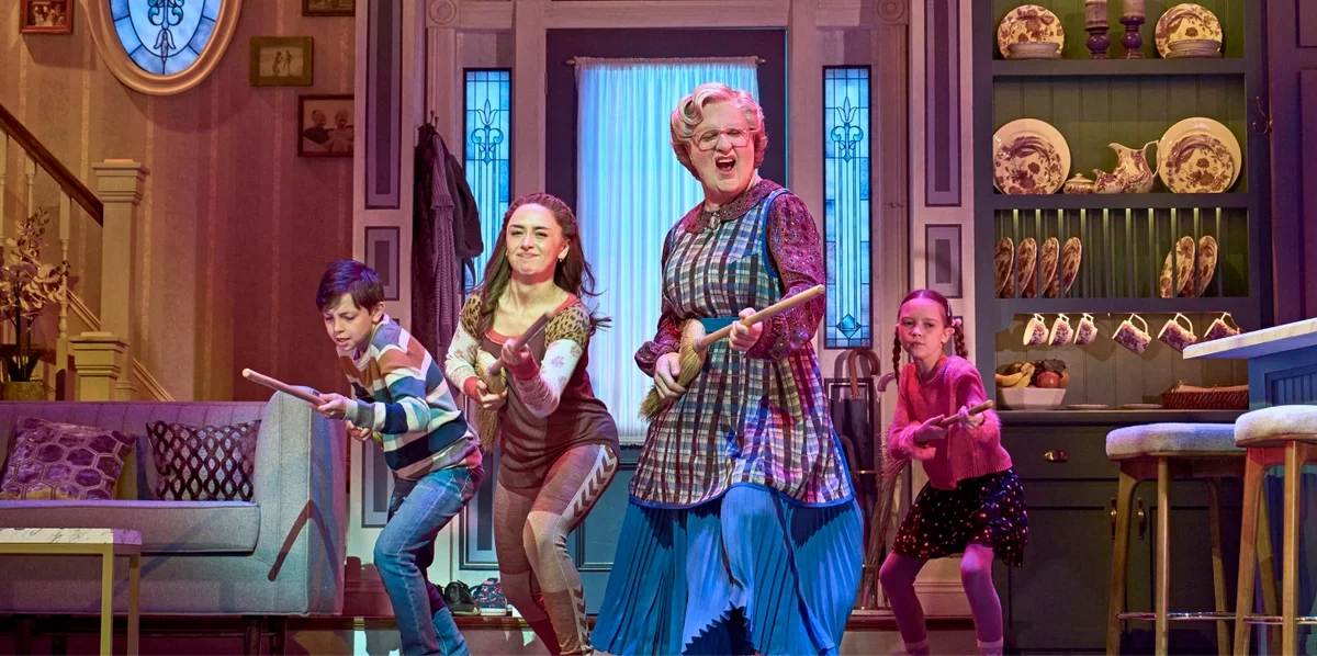 West End cast of Mrs. Doubtfire shreds their air guitar brooms. 