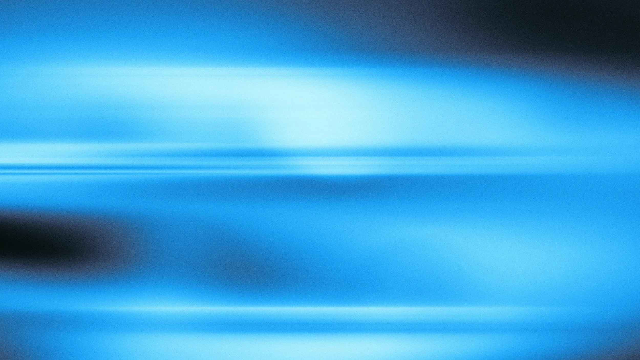 Blurred blue streaks and horizontal lines with dark areas on the sides.