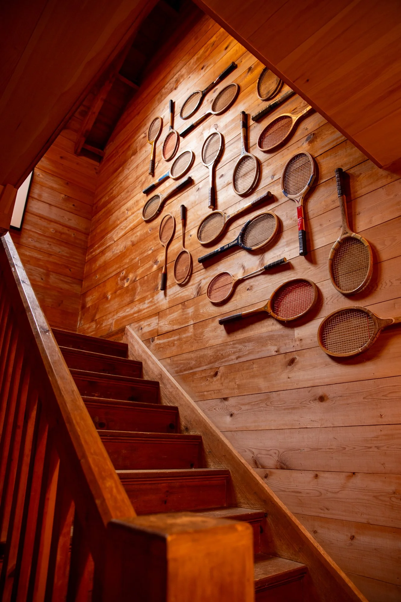 high-head-brooklin-maine-staircase-vintage-tennis-racket-wall-art.jpg