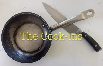 A small saucepan with a white substance being heated, a large kitchen knife, and a black-handled spatula on a white surface, with text reading 'The Cook-Ins' overlaid.