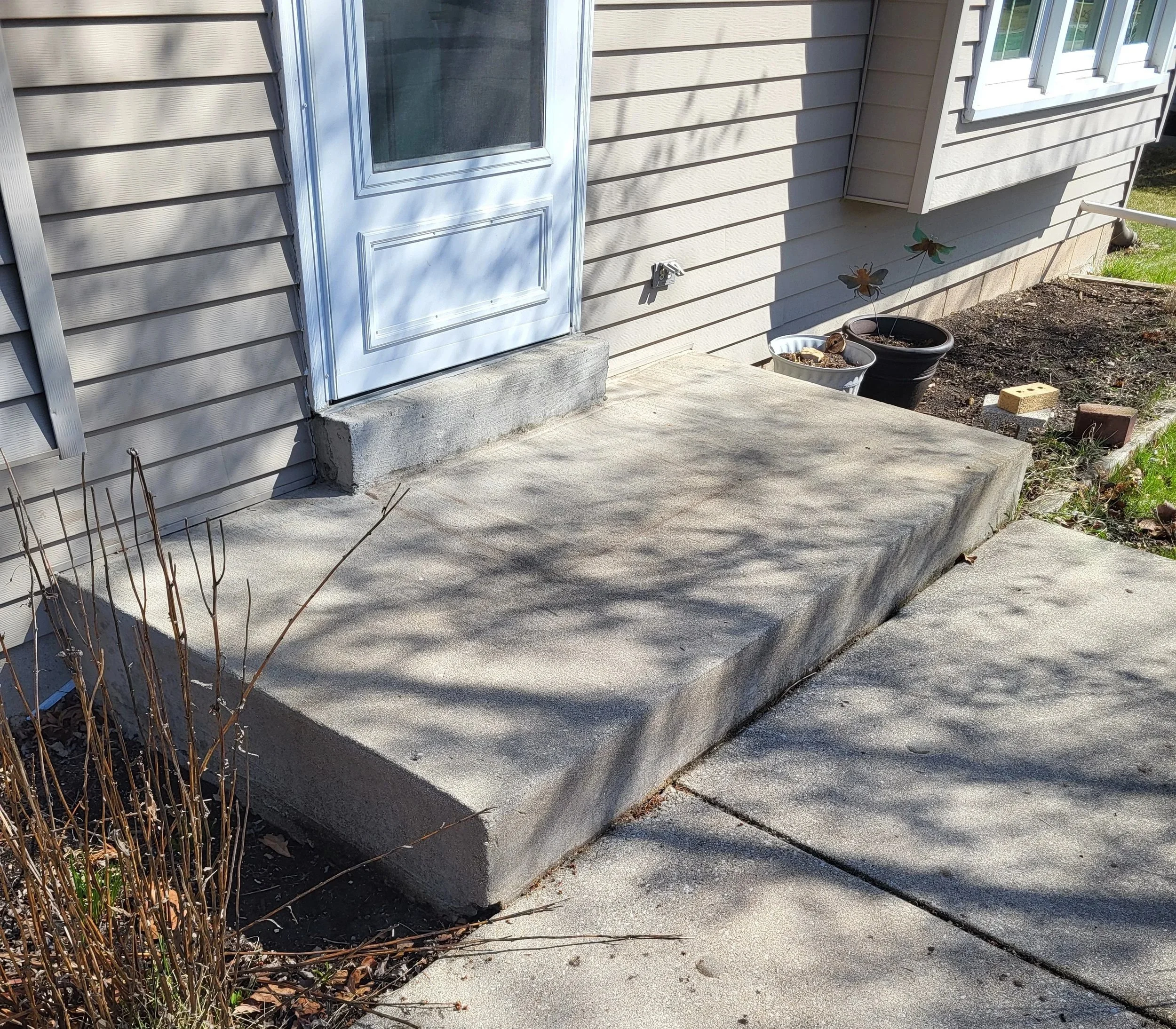 Before - the homeowner had to manage an 8" step up into their house from the concrete stoop.